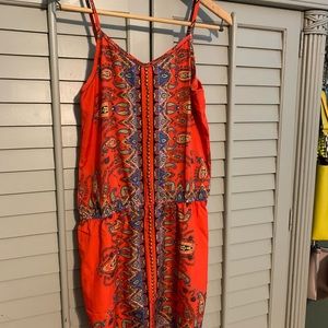 Bright and fun silky tunic top. Elasticized waist.